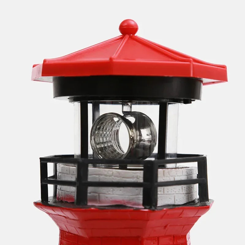 Solar Rotating Lighthouse Resin Garden Sculpture — front angle